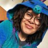 End-of-winter updates and things person with locks and light skin in blue and purple dragon pajamas